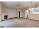 Open living room featuring plush carpeting, a fireplace, and an open-concept design at 3802 Austin Park Ln, Decatur, GA 30032