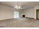 Bright living room featuring plush carpeting, a fireplace, and sliding door access to the outdoors at 3802 Austin Park Ln, Decatur, GA 30032