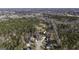 Aerial view of a tranquil suburban neighborhood with single-Gathering homes nestled among mature trees at 309 Tanglewood Trl, Carrollton, GA 30116