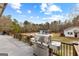 Outdoor deck with stainless steel grill overlooking the pool and backyard at 203 Shelby Ln, Fayetteville, GA 30215