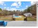 Spacious outdoor deck overlooking the pool and well-maintained backyard at 203 Shelby Ln, Fayetteville, GA 30215