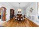 Formal dining room with hardwood floors, a chandelier, and large windows at 203 Shelby Ln, Fayetteville, GA 30215