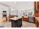 Expansive kitchen featuring stainless appliances, a farmhouse sink, and a center island at 203 Shelby Ln, Fayetteville, GA 30215