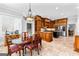 Spacious kitchen featuring custom wood cabinets, an island, and stainless steel appliances at 203 Shelby Ln, Fayetteville, GA 30215