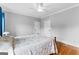 Bright main bedroom with hardwood floors and a ceiling fan at 203 Shelby Ln, Fayetteville, GA 30215