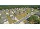 An aerial shot displays a residential neighborhood with tree-lined streets and well-maintained homes at 316 Denton Way, Hampton, GA 30228