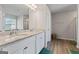 Bright bathroom featuring a double sink vanity with granite countertop and white cabinets at 316 Denton Way, Hampton, GA 30228