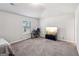 Bright bedroom with vaulted ceiling, carpeted floor, and a window at 316 Denton Way, Hampton, GA 30228