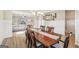 Inviting dining room featuring wainscoting detail and a large wood table with seating for eight at 316 Denton Way, Hampton, GA 30228