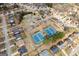 Aerial view showcasing community tennis courts, pool, and lush landscaping in a desirable neighborhood at 306 Interlake Pass, Mcdonough, GA 30252