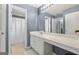 Clean bathroom with gray walls and tile flooring at 306 Interlake Pass, Mcdonough, GA 30252