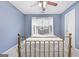 Bedroom with blue walls and a large window at 306 Interlake Pass, Mcdonough, GA 30252