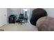 Neutral bedroom with a leather office chair, weights, and bean bag at 306 Interlake Pass, Mcdonough, GA 30252