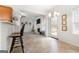 Cozy breakfast nook with bar seating and an open view to the living room at 306 Interlake Pass, Mcdonough, GA 30252