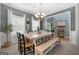 Cozy dining room featuring a wooden table, bench seating, and charming decor at 306 Interlake Pass, Mcdonough, GA 30252