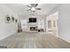 Large living room with a cozy fireplace and ample natural light at 306 Interlake Pass, Mcdonough, GA 30252