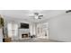 Bright living room with a fireplace, white mantel, and large windows at 306 Interlake Pass, Mcdonough, GA 30252