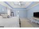 Carpeted primary bedroom with a trey ceiling and ensuite bathroom at 306 Interlake Pass, Mcdonough, GA 30252