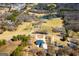 A stunning aerial view of a rural neighborhood, showcasing the home and pond at 111 Dixson Rd, Bowdon, GA 30108