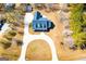 Overhead shot showcasing home's roofline, circular driveway, and manicured grounds at 111 Dixson Rd, Bowdon, GA 30108