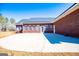 Brick home exterior featuring a spacious concrete patio, perfect for outdoor gatherings and relaxation at 111 Dixson Rd, Bowdon, GA 30108