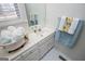 Bathroom vanity with white cabinets, countertop, and tile flooring at 111 Dixson Rd, Bowdon, GA 30108