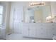 Bathroom with tile flooring, large mirror, and vanity with storage at 111 Dixson Rd, Bowdon, GA 30108