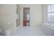 Bathroom featuring tub, shower, and open doorway to another room at 111 Dixson Rd, Bowdon, GA 30108