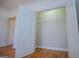 Spacious closet with adjustable shelving system and hardwood floors at 111 Dixson Rd, Bowdon, GA 30108