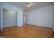 An airy bedroom with hardwood floors, crown molding, and a closet provides ample storage at 111 Dixson Rd, Bowdon, GA 30108