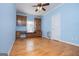 This bedroom offers classic hardwood floors, ceiling fan, and a charming window seat at 111 Dixson Rd, Bowdon, GA 30108
