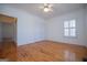 Bedroom with hardwood floors, closet, window and doorway to another room at 111 Dixson Rd, Bowdon, GA 30108