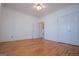 A bedroom with hardwood floors, closet and doorway to another room at 111 Dixson Rd, Bowdon, GA 30108