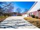 Long driveway leading to a brick home with an attached garage and well-maintained landscaping at 111 Dixson Rd, Bowdon, GA 30108