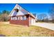 Exterior view of home with brick siding, white trim, and well-manicured lawn at 111 Dixson Rd, Bowdon, GA 30108