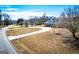 Residential house set back from the road showcasing a circular driveway and mature trees at 111 Dixson Rd, Bowdon, GA 30108