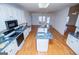 Bright, open kitchen boasts a center island, white cabinets and modern appliances at 111 Dixson Rd, Bowdon, GA 30108