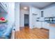 Bright kitchen featuring white cabinets and hardwood floors at 111 Dixson Rd, Bowdon, GA 30108