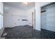 Functional laundry room features durable flooring, storage space and a utility sink at 111 Dixson Rd, Bowdon, GA 30108