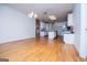 Open living space with hardwood floors leading to the bright kitchen at 111 Dixson Rd, Bowdon, GA 30108