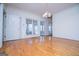 Bright living room with hardwood floors, white trim, and large windows at 111 Dixson Rd, Bowdon, GA 30108