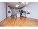 Open living space with hardwood floors leading to the bright kitchen at 111 Dixson Rd, Bowdon, GA 30108
