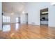 Open-concept living room with hardwood floors seamlessly connects to the kitchen at 111 Dixson Rd, Bowdon, GA 30108