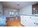 Bright living room with hardwood floors, white trim, and large windows at 111 Dixson Rd, Bowdon, GA 30108