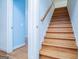 Attractive staircase with wood treads and natural light enhances this home's character at 111 Dixson Rd, Bowdon, GA 30108