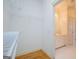 Walk-in closet with shelving and an open doorway leading to the bathroom vanity at 111 Dixson Rd, Bowdon, GA 30108