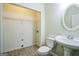 Bright bathroom with tile floor, toilet and sink at 12 Paces Lakes Overlook, Dallas, GA 30157