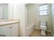 Bright bathroom with tub, sink and toilet at 12 Paces Lakes Overlook, Dallas, GA 30157