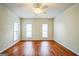 Spacious bedroom with ceiling fan and generous windows at 12 Paces Lakes Overlook, Dallas, GA 30157