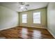 This bedroom is spacious, with great natural light, and neutral paint at 12 Paces Lakes Overlook, Dallas, GA 30157
